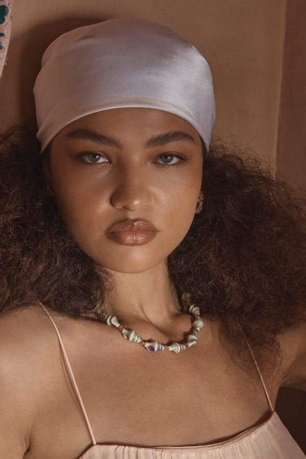 Trevi Necklace by Amber Sceats – handcrafted in Italy with 24K gold-plated brass and ceramic shells, inspired by Mediterranean elegance.
