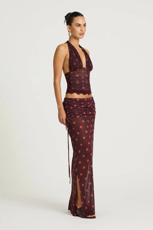 Penelope Top Plum Spot by Benni, a plunge halter lace-trim style with adjustable ties and stretch mesh lining for elevated day-to-night dressing.
