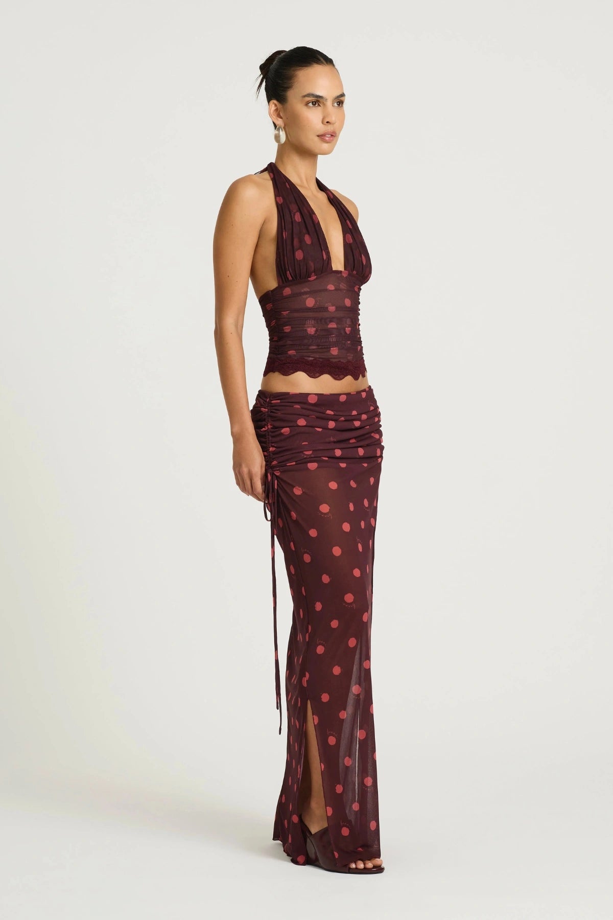 Penelope Top Plum Spot by Benni, a plunge halter lace-trim style with adjustable ties and stretch mesh lining for elevated day-to-night dressing.
