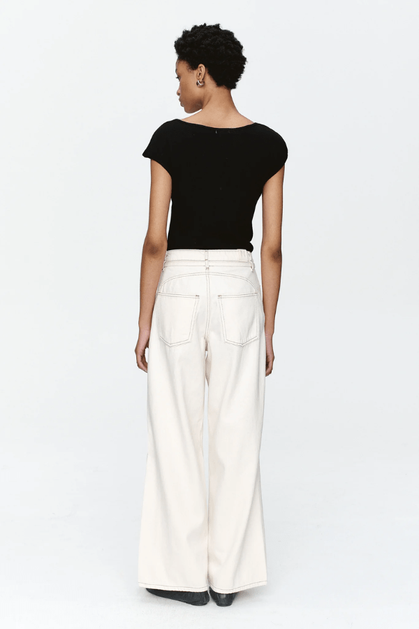 Tie Curve Seam Jean Ecru by Marle, trendy mid-rise jeans with unique curved seam detailing and a relaxed, wide-leg fit. Perfect for a versatile, structured look with a detachable tie belt.