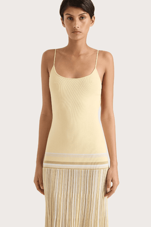 Citara Maxi Dress Butter Stripe by Faithfull the Brand – Trendy ribbed knit maxi with adjustable straps and backless tie, perfect for effortless summer elegance and beach days.