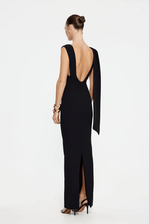 Audrey Gown Black by Effie Kats – A stretch-crepe gown with a straight neckline and dramatic low back, perfect for black-tie affairs, red carpet moments, or elegant evening events.