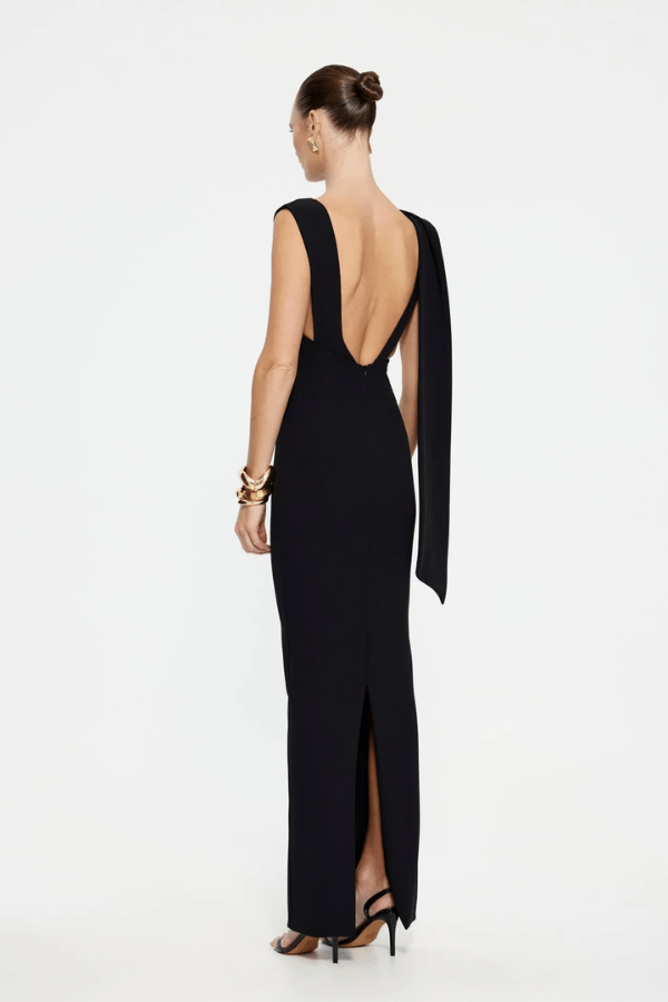 Audrey Gown Black by Effie Kats – A stretch-crepe gown with a straight neckline and dramatic low back, perfect for black-tie affairs, red carpet moments, or elegant evening events.