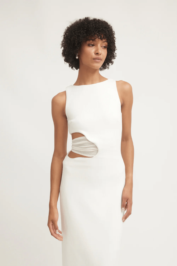 Valentina Dress Ivory by Tojhà – A sophisticated maxi in ultra-soft crepe with boat neckline, curved cut-out, and mesh detail, perfect for elegant evening occasions.