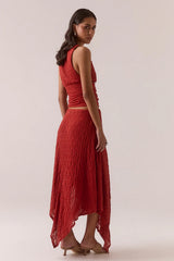 Aaila Lace Skirt – Blood Orange by Sovere, stretch lace midi with asymmetric hem and removable lining. Perfect for elevated looks.