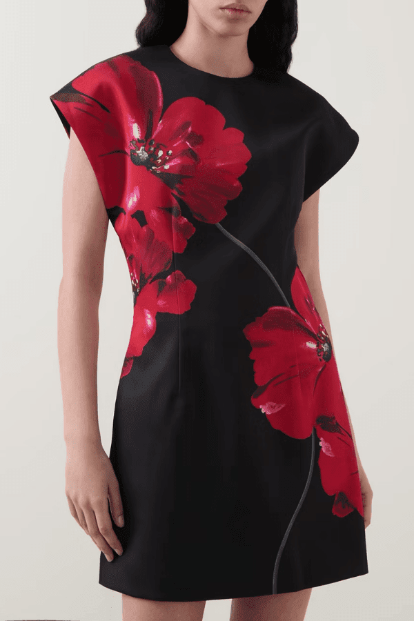 Chaya Mini Poppy Print Black Base by Rebecca Vallance – A trendy structured A-line mini with floral poppy print, round neckline, and dropped shoulders, perfect for special occasions or elevating everyday style with a polished, feminine touch.