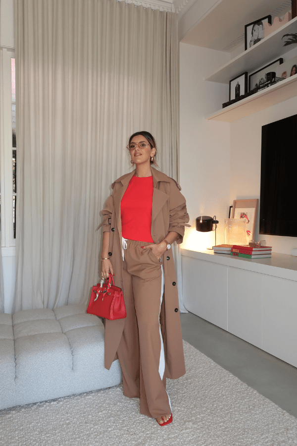 Trench Coat Tan by Sneaky Link – A timeless oversized coat in rich tan polyester, featuring classic details and subtle snake embroidery. Perfect for stylish transitional days.