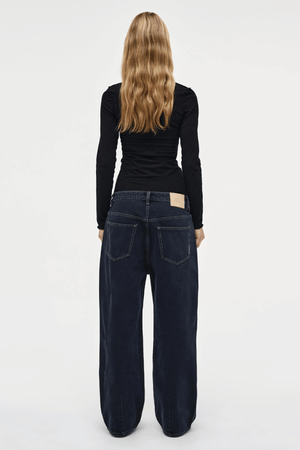 Yoko Baggy Send Off Mid Vintage Indigo by Neuw Denim, trendy oversized baggy jeans with a low-rise waist and ultra-relaxed fit. Perfect for a slouchy, lived-in look with styling versatility, crafted from rigid denim that molds to your shape over time.
