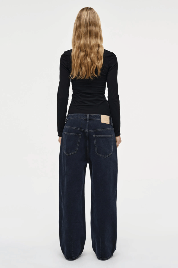 Yoko Baggy Send Off Mid Vintage Indigo by Neuw Denim, trendy oversized baggy jeans with a low-rise waist and ultra-relaxed fit. Perfect for a slouchy, lived-in look with styling versatility, crafted from rigid denim that molds to your shape over time.