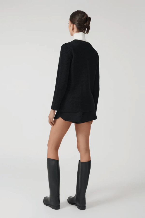 Helena Jacket Black by Onte – A stylish reinterpretation of the iconic Helena gilet, made from breathable 100% cotton yarn with a unique crochet-style stitch. Features a loose fit, gold Onte buttons, long sleeves, crew neck, and patch pockets.