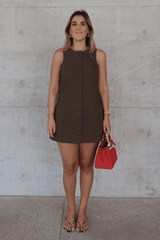 Kate Mini Dress Cocoa by Sneaky Link – A trendy and polished mini dress crafted from luxe suiting fabric, featuring a high scoop neckline and flattering A-line silhouette, perfect for brunch, work, or casual chic outings.
