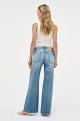 Eva Wide Arrival by Neuw Denim, trendy mid-rise jeans with a wide leg fit, crafted from cotton-rich denim. Perfect for a comfortable yet edgy look, featuring a classic button and zip fly with front and back pockets.