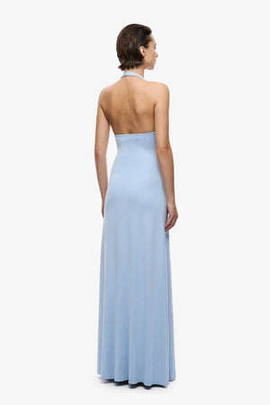 Jennifer Cupro Dress Cornflower Blue by Misha, a plunging halter maxi with gathered waist and waterfall sash for fluid, elegant movement.
