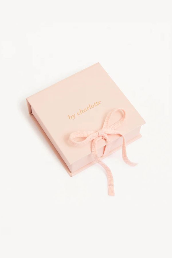 14k Solid Gold Celestial Sleeper by By Charlotte, delicate hoop earring encrusted with white cubic zirconia crystals, perfect for effortless stacking or celestial-inspired layers. Sold as a single earring.