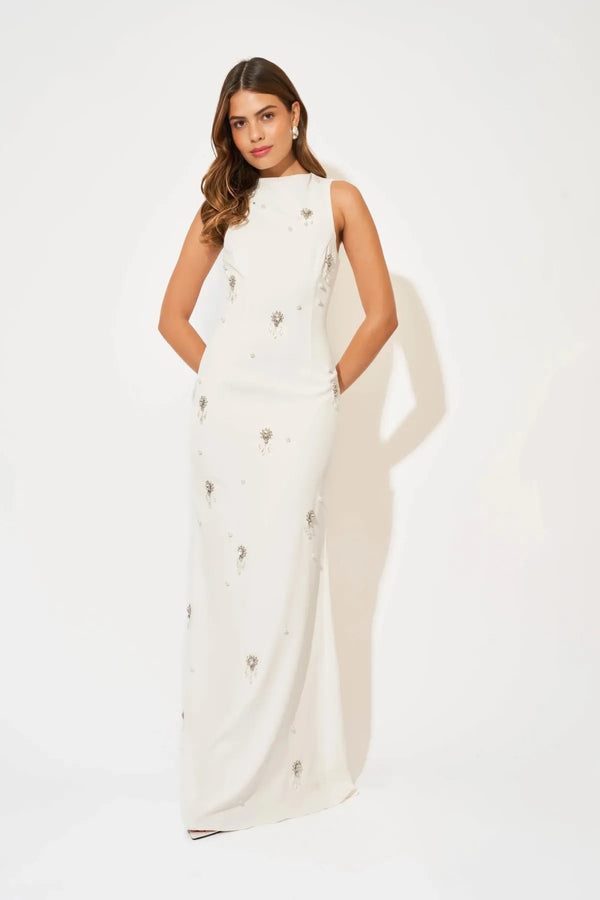 Crystal Maxi Dress by Odd Muse, a white bridal maxi with crystal and pearl detailing, high neckline and elegant fitted silhouette.
