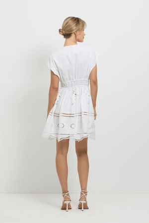 Sunrise Spirit Dress White by Pasduchas – A trendy, embroidered Tencel-linen blend dress with adjustable ties and scalloped hem, perfect for chic day-to-night occasions.