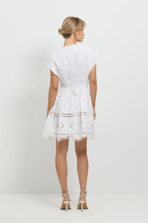 Sunrise Spirit Dress White by Pasduchas – A trendy, embroidered Tencel-linen blend dress with adjustable ties and scalloped hem, perfect for chic day-to-night occasions.