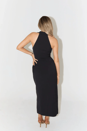 The Ultimate Muse Collar Maxi Dress Black by Odd Muse – A sharp-collared, sleeveless maxi with button front and front slit, perfect for summer dinners, holiday escapes, or elegant city strolls.