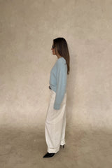 Blue Kaia crew neck sweater with long sleeves and a relaxed fit.