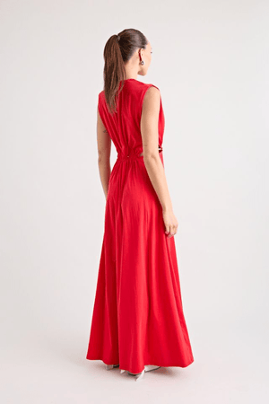 Do For Love Gown Red by Pfeiffer – A trendy low plunge maxi gown with bold hardware and thigh-high split, perfect for turning heads at special occasions.