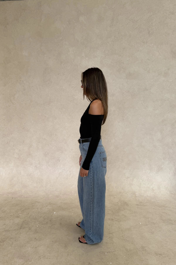 Issy Long Sleeve Top Black by Sneaky Link – Luxuriously soft modal-spandex with an off-shoulder neckline and built-in halter for support. Delicate fabric; handle gently. Cold hand wash.