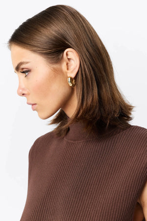 Quiet Force Midi Dress by Mossman in cacao, ribbed knit with turtleneck and flared skirt for sleek, sculpted day-to-night dressing.