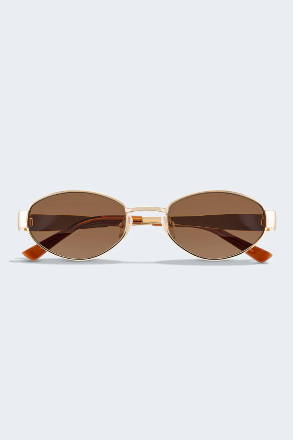 MU 52YS Brass Gold w, dark brown by Miu Miu, oval metal frame in pale gold with grey gradient polyamide lenses, narrow fit, high bridge nosepads for style and comfort.