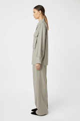 Drew Shirt Mottled Stone by Camilla and Marc – Oversized boxy shirt with 3D utility pockets, shoulder epaulettes with branded buttons, and concealed button placket. Crafted in soft wool-poly blend.