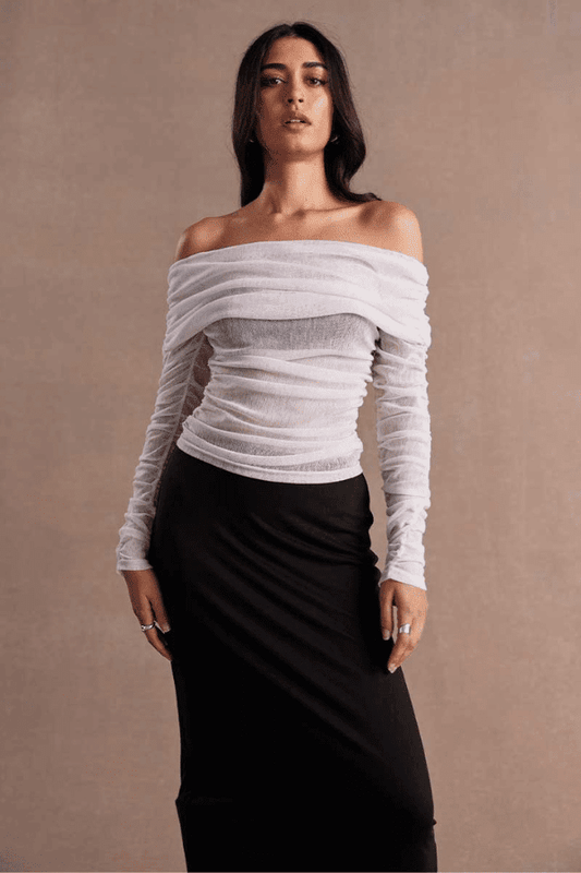 Emara Sleeveless Mini Dress Black by Sovere – fitted mini dress with pleats, keyhole neckline, tie details, and back zipper.