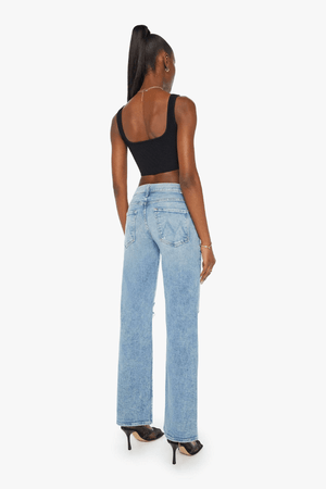 Mid Rise Maven Sneak Peak A Boo by Mother Denim, mid-rise relaxed wide-leg jeans with distressed knees, light-blue wash, perfect for casual cool style.