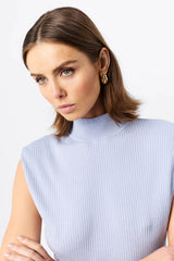 Quiet Force Top by Mossman in sky blue, ribbed sleeveless turtleneck with removable shoulder pads for sleek everyday styling.
