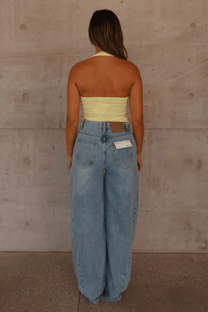 Bella Halter Tank Lemon by Sneaky Link – Soft cotton-spandex tank with deep scoop neckline and open back. A trendy, breathable piece for viral summer vibes.