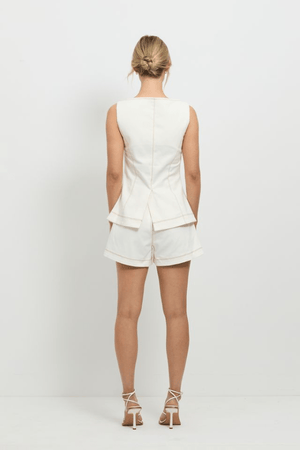 Good Vibes Top White by Pasduchas, stretch denim with contrast topstitching, gold snap studs, and mock pockets, perfect for trendy viral casual and coordinated looks.