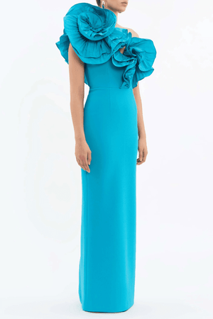 Ella Gown Blue by Rebecca Vallance – Crepe one-shoulder gown with applique neckline, cinched waist, back split, side zip.