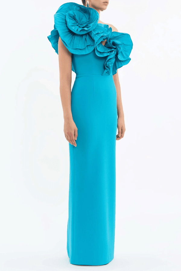 Ella Gown Blue by Rebecca Vallance – Crepe one-shoulder gown with applique neckline, cinched waist, back split, side zip.