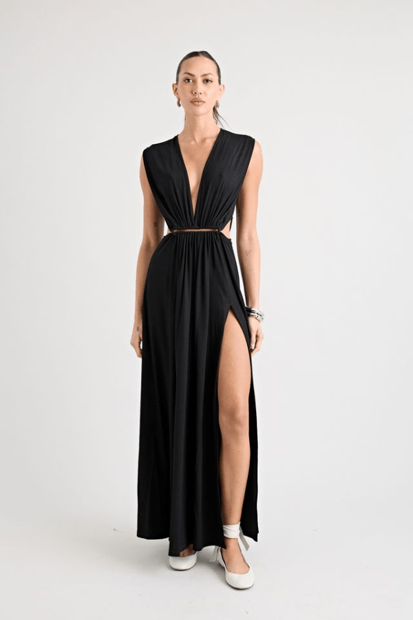 Do For Love Gown Black by Pfeiffer – A trendy, elegant low-plunge maxi with bold hardware and thigh-high split, perfect for special occasions and modern sophistication.