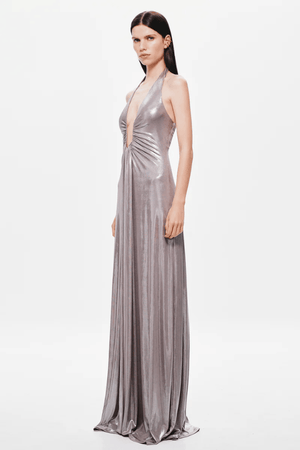 Jennifer Foil Jersey Dress Cinder by Misha – Trendy slim-fit maxi with deep V halter neckline, gathered waist, and cascading sash, perfect for glamorous day-to-evening occasions.