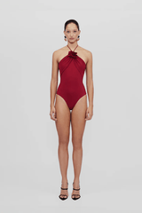 Agapi One Piece Carmesi by Maygel Coronel, halter swimsuit with floral detail and open back. Perfect for beach days or bold swim styling.