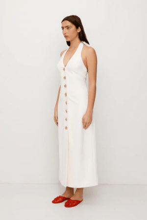 Irida Maxi Dress Ivory by The Wolf Gang – A trendy fitted maxi with halter neckline and gold swirl details, perfect for timeless elegance at special occasions.