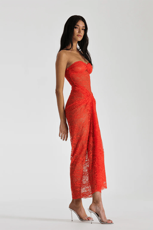 Naomi Dress Tangerine by Natalie Rolt – A strapless lace dress with ruched knot detail and soft draping, perfect for summer weddings, garden parties, or sunset soirées.