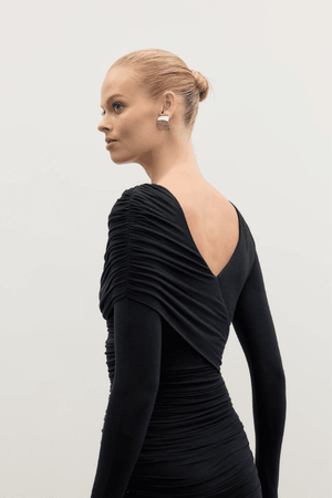 Kai Mini Dress Shadow by Bayse – Trendy ruched mini with asymmetric draped bodice, high boat neck, and bold deep V-back. Perfect for chic nights out and special events.