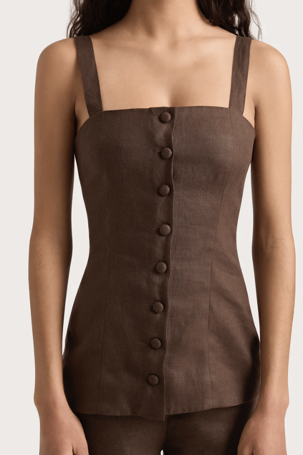 Corbiere Vest Bistre by Faithfull the Brand, sophisticated 100% European Flax® linen vest with wide straps, straight neckline, and mock buttons, perfect for trendy viral layering and elegant summer looks.
