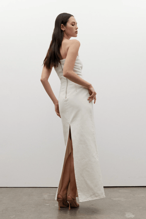 Amiri Denim Dress Angora by Bayse, a trendy, strapless denim dress with a corset-style bodice that sculpts your figure. Perfect for chic day-to-night looks.