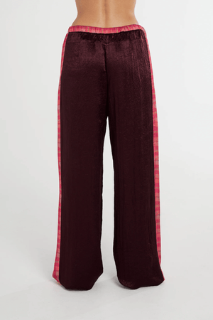 Boxer Pant Plum by Summi Summi, relaxed wide-leg pant with drawstring waistband and NEON PLAID side panels for a stylish, comfortable fit. Made from 100% acetate woven fabric.