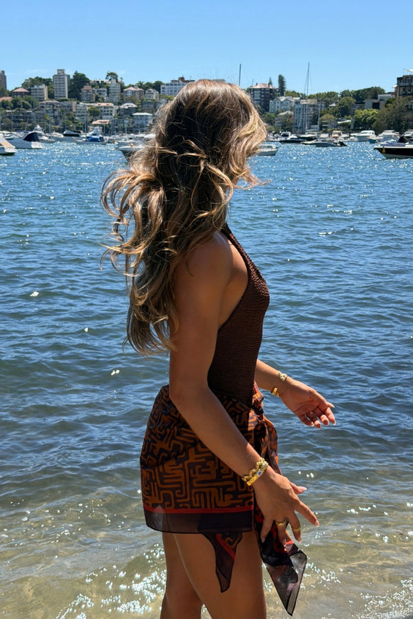 Sandy Swim by Hunza G, shimmering halter swimsuit in metallic crinkle fabric that stretches to flatter every curve.