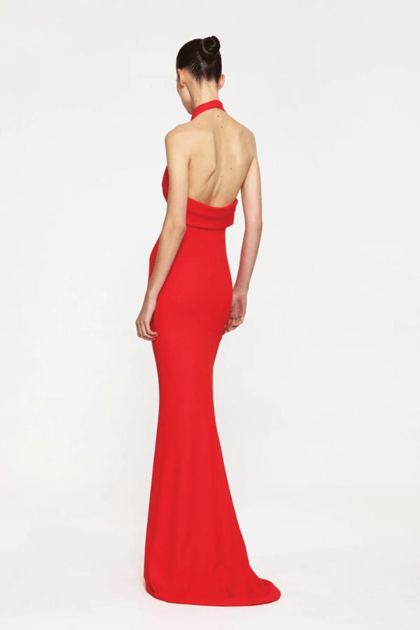 Sydney Gown Red by Effie Kats – A bold and trendy stretch-jersey gown with elegant ruching and a daring thigh-high split, perfect for special evening occasions.