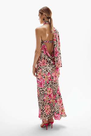 Hera Maxi Dress Safaria by Cin Cin – A trendy maxi blending vibrant floral and animal prints with a halter neckline and flowing silhouette. Perfect for resort wear and tropical events.