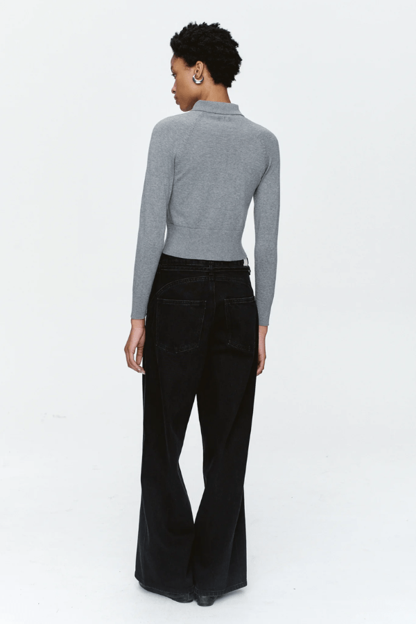Tie Curve Seam Jean Black by Marle, trendy mid-rise jeans with unique curved seam detailing and a relaxed, wide-leg fit. Perfect for a versatile, structured look with a detachable tie belt.