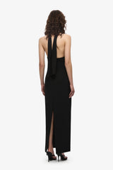 The Capezza Silk Dress by MISHA, a halter midi dress with plunge neckline, silk wrap, and open back. Perfect for elevated evenings.