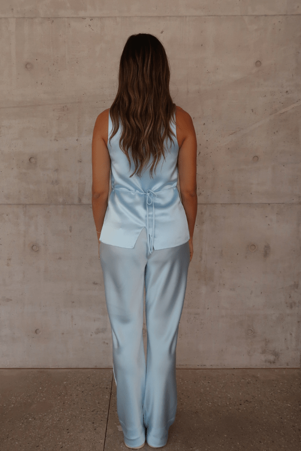 Maja Vest Blue by Sneaky Link – Trendy double-lined satin vest with a chic square neckline and adjustable drawstring back, perfect for polished day or night looks.